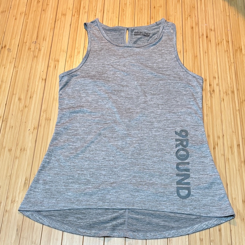 9 Round criss cross back tank top. High low hem. Size S.